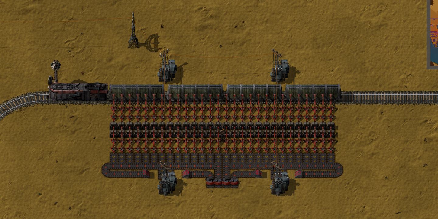 A dense train in the current (0.12) version, though assuming idealized perfectly-7-tile long cargo wagons, at a poorly working high-speed unloading station.